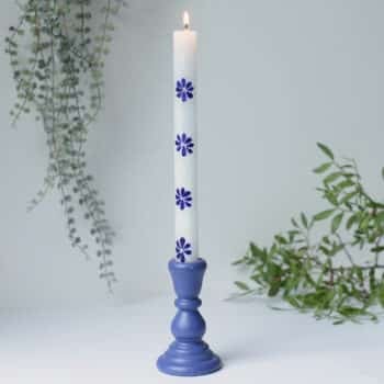 White Candle with Blue Petals